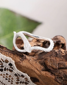 Detailed macro view of S925 sterling silver snake ring with textured scale patterns