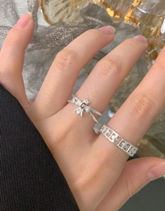 Detail of S925 silver ring set with dragonfly design and geometric hammer texture