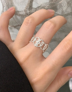 Detailed view of S925 silver heart ring with vintage cross pattern and hammered texture