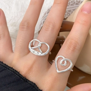 S925 sterling silver pretzel and heart shaped ring set shown on model's hand