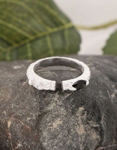 Macro view of S925 silver ring with snake scale texture and black-and-white zircons