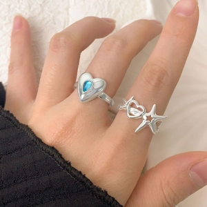 S925 sterling silver ring set featuring hollow star and blue heart-shaped gemstone