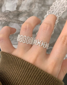 Detail of S925 sterling silver multilayer woven mesh ring on hand for women