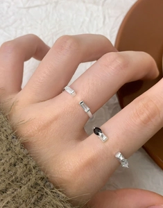 Macro shot of S925 silver open rings with black and clear zircon stone details