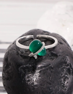 Macro shot of S925 sterling silver ring featuring a green chalcedony stone and pavé accents