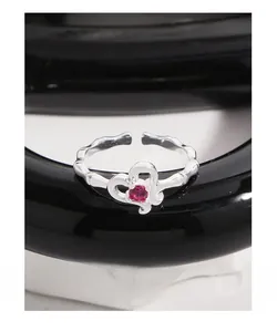 Detailed macro view of S925 silver ring featuring bamboo texture and pink heart zircon