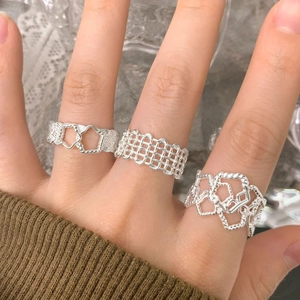 Three-piece S925 silver irregular hollow woven rings displayed on hand model