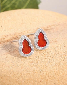 Close-up of S925 silver gourd earrings with red carnelian and sparkling zircon pavé