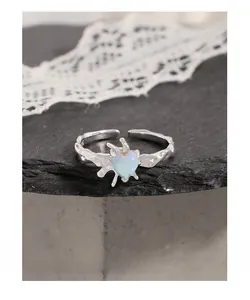 Macro shot of heart-shaped moonstone and melted texture detail on S925 silver ring