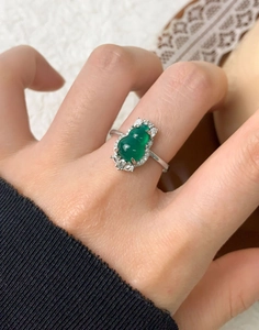 Detail view of a S925 silver ring with a green gourd chalcedony and zircon accents