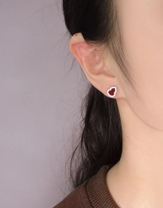 Close-up of S925 silver heart stud earrings with red chalcedony and white zircons