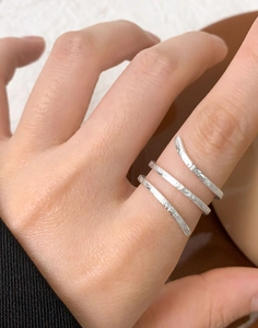 Close-up of triple-layered silver S925 ring with handcrafted snake skin hammered texture