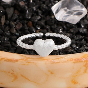 S925 sterling silver twist rope open ring with matte 3D heart on black stone background