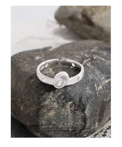 Macro shot of S925 sterling silver stamp on an oval zircon adjustable open ring