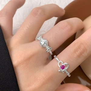 S925 silver heart ring with magenta zircon and candy design on a woman's hand