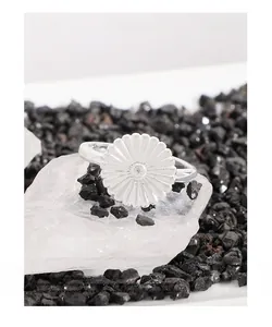 Detailed macro view of S925 sterling silver daisy ring with sparkling zircon stone center