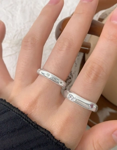 Close-up of S925 sterling silver rings set with white zircon and pink gemstones