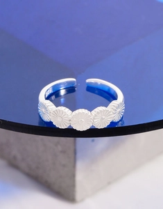 Macro shot of S925 sterling silver stamp on the inner band of floral open ring