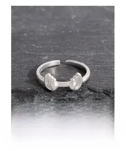 Macro shot showing S925 sterling silver hallmark on minimalist wave open ring