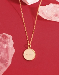 Macro shot of S925 hallmark on gold plated sterling silver star necklace pendant