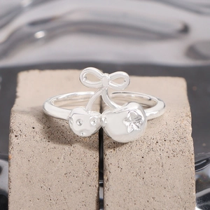 Elegant S925 sterling silver open ring with bow and star-inlaid cherry design