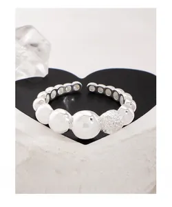 Detail shot of a silver s925 adjustable bubble ring with smooth and textured beads