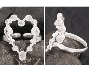 Macro view of S925 sterling silver heart ring with sparkling white zircon inlay