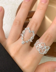 Detailed view of S925 silver heart open ring featuring zircon stones and intricate weave