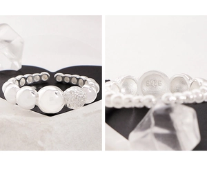 Detailed close-up showing the S925 silver hallmark and textured bead on the open ring