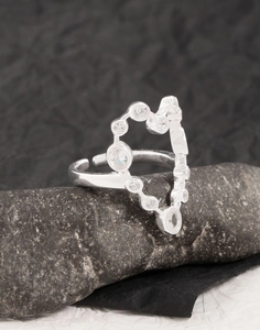 Macro detail of S925 sterling silver open ring featuring a zircon heart outline