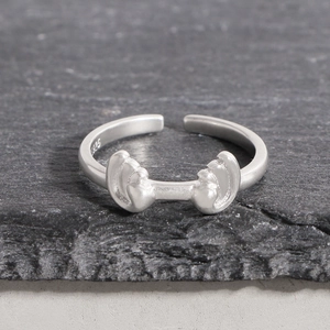 S925 sterling silver dumbbell shaped open ring with a matte finish on grey stone