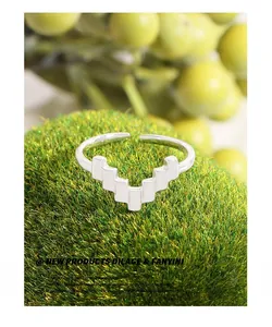 Detailed close-up of S925 sterling silver geometric pixel ring on green moss