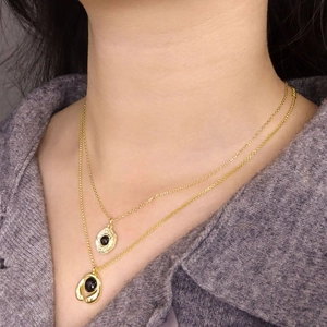 Double-layered gold necklace for women featuring elegant black round agate pendants