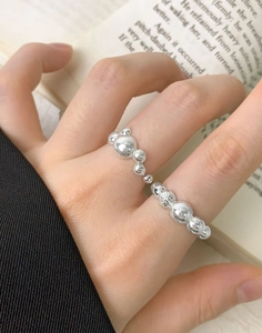 Detail of S925 sterling silver beaded ring featuring gradient bubble design on a finger