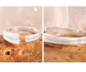 Macro shot of S925 sterling silver stamp on minimalist double-layer open ring detail