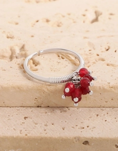 Close-up of S925 silver adjustable ring featuring five dangling red faceted crystal beads