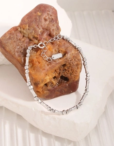 Close-up of S925 sterling silver beaded bracelet with faceted beads and bamboo segments