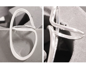 Detailed view of the S925 hallmark on minimalist irregular curved silver ring