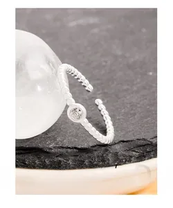 Macro detail of S925 sterling silver beaded ring with sparkling round zircon stone