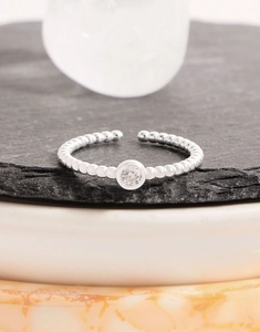 Detailed macro shot of an adjustable S925 silver beaded ring with a clear zircon stone
