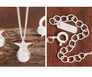 Detail of S925 sterling silver star pendant and hallmark stamp on the ball chain