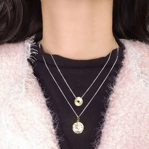 Dual-layer S925 silver necklace with textured round gold pendant and vintage coin charm
