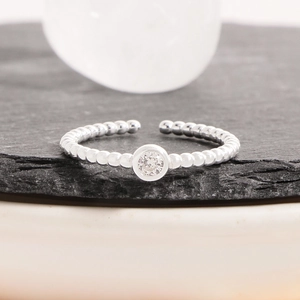 Adjustable S925 sterling silver beaded ring featuring a brilliant round cubic zirconia stone