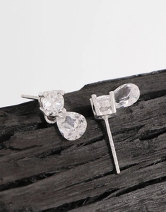 Detailed close-up of S925 sterling silver stamp on pear-cut zircon teardrop earrings