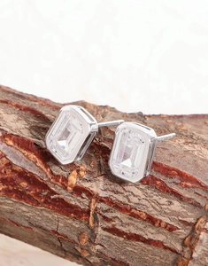 Macro shot of emerald-cut square cubic zirconia stud earrings in a 925 silver setting