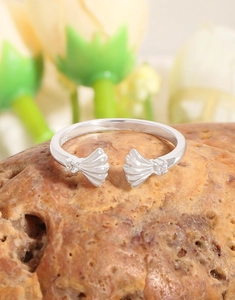 Detail view of S925 sterling silver shell open ring with sparkling cubic zirconia accents