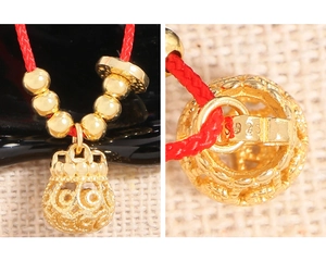 Detailed macro view of S925 sterling silver hallmark on golden money bag charm