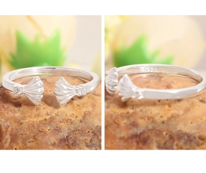 Detailed view of S925 sterling silver shell ring with engraved hallmark on textured stone