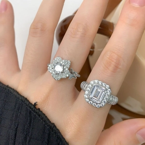 S925 sterling silver twist ring set with flower and emerald cut cubic zirconia stones