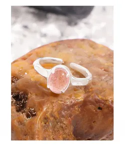 Detail of natural strawberry crystal ring with S925 silver textured adjustable band
